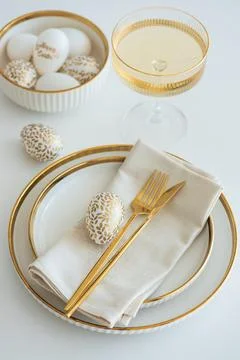 Elegant Easter Table Setting with Decorative Egg and Spring Details Stock Photos