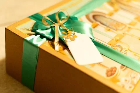 Elegant Eid Mubarak Gift Box with Decorative Islamic Design and Green Ribbon Stock Photos
