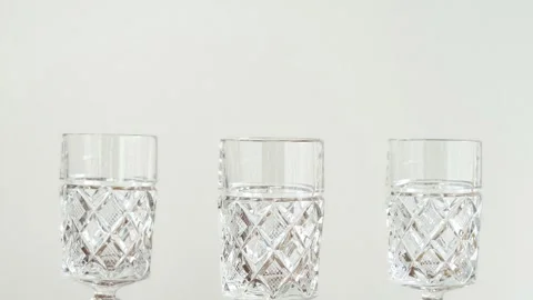 Elegant empty crystal glasses with high stem on the table Stock Footage 287916353