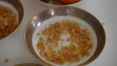 An Elegant Empty Plate that Features a Touch of Beautiful Gold Trim for Added  Stock Footage 295421910