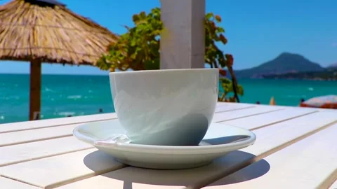 Elegant Espresso Coffee Cup on White Beach Restaurant Table Bar Montenegro. Stock Footage 342000838