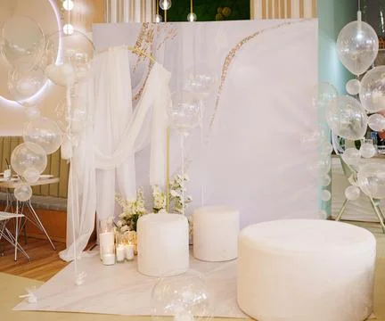 Elegant event setup with white decor in a modern space 写真素材
