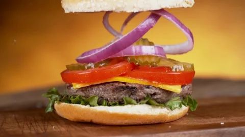 Elegant Fall: Perfectly Bouncing Hamburger Stock Footage 275731418