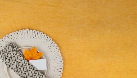 Elegant fall table setting with a single leaf and napkin, place for text Stock Photos