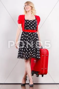 Elegant fashion woman with red suitcase Stock Photos