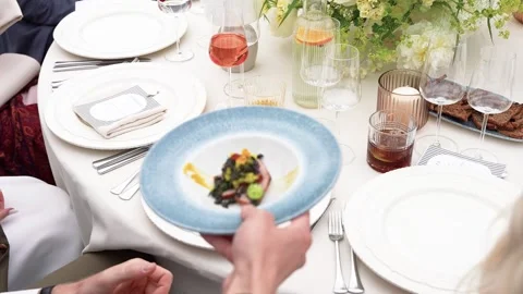 Elegant Fine Dining Table Setting With Gourmet Dish at Upscale Restaurant Event Stock Footage 338166315