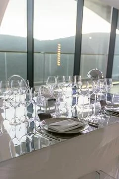 Elegant fine dining table setting with glassware prepared for luxury event .. Stock Photos