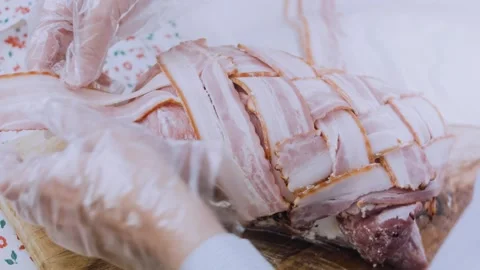 Elegant finished dish: securing a bacon wrapped tenderloin Stock Footage 342184743