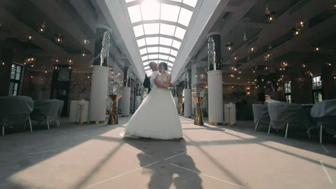 Elegant First Dance: Bride and Groom in Wedding Hall, Newlyweds share their Stock Footage 265160842