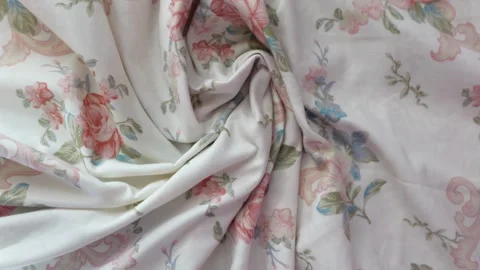 Elegant floral pattern fabric draped in soft folds with pink and blue vinta.. Stock Footage 333033480