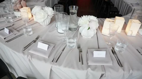 Elegant Formal Table Setting With White Florals and Candlelight at Event Stock Footage 337435056
