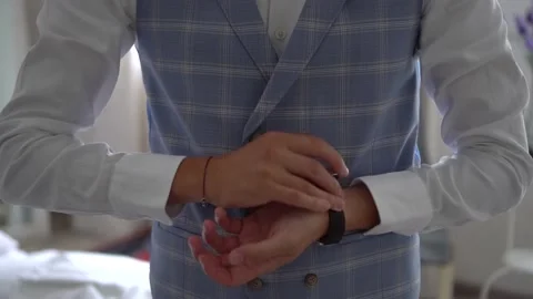 Elegant guy putting on a watch Stock Footage 232767042