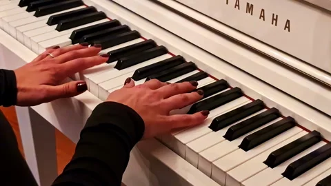 Elegant Hands Mastering Piano Keys in Riga, Latvia for a Calm Melody Stock Footage 318729050