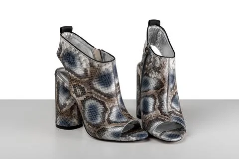 Elegant high heel python snake skin woman shoes isolated on white background. 스톡 사진