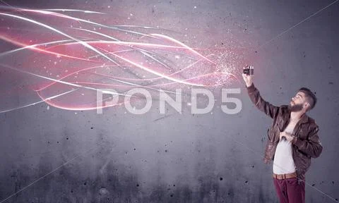 Elegant hipster with camera and bright lines Stock Photos