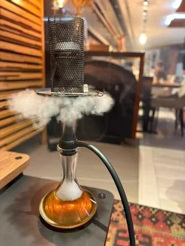 Elegant hookah setup on a table indoors Foto stock
