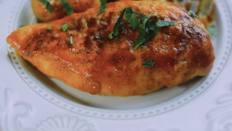 Elegant kitchen technique: cutting tender chicken on a white dinner plate Stock Footage 342180942