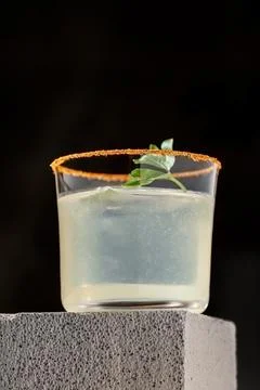 Elegant luxury cocktail in front of dark background Stock Photos