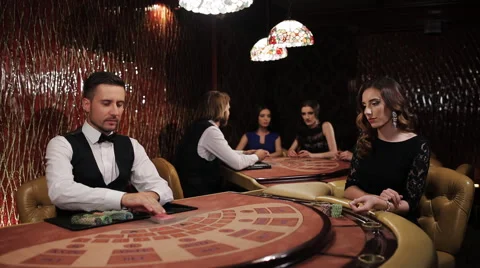 Elegant luxury girl in black dress playing blackjack in casino Stock Footage