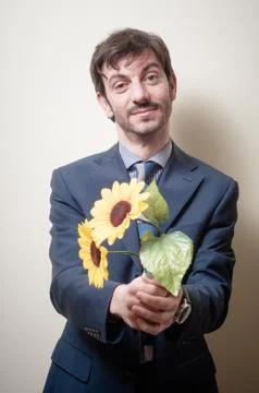 Elegant man with daisies Stock Photos