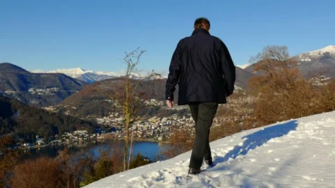 Elegant Man Making and Throwing a Snow Ball and Joy Mountain View 動画素材 194011829