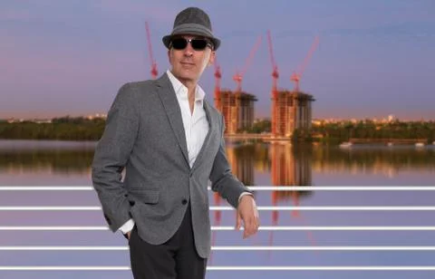 Elegant man posing in front of construction site Stock Photos