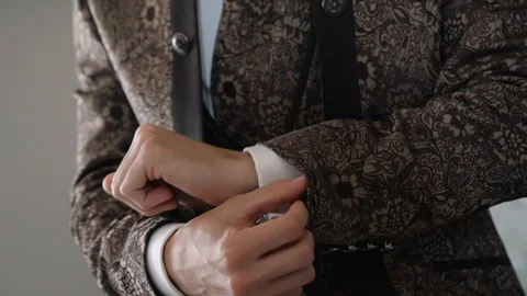 Elegant man in suit wearing a luxury watch on his wrist. Slow motion Full HD Stock Footage