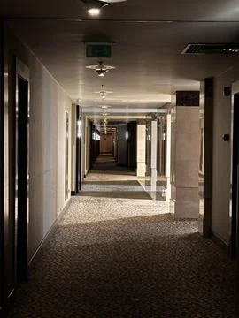 Elegant marble hotel corridor with patterned carpet and cozy lights Stock-Fotos