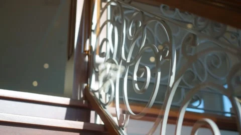 Elegant metal patterns on a staircase railing in a luxury home Stock Footage 320222186