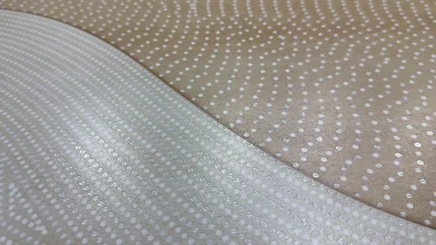 Elegant Metallic Dotted Wallpaper Texture with Soft Light Reflections. Stock Footage 331120214