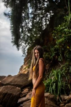 An Elegant Model Gracefully Posing Amid Nature by the Beautiful and Peaceful Stock Photos