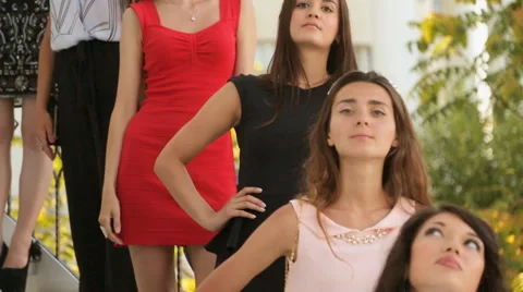 Elegant models posing on the stairs outside Stock Footage 59657202