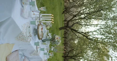 An Elegant Outdoor Dining Setup Set Against the Beautiful Backdrop of Natures Stock Footage 305647233