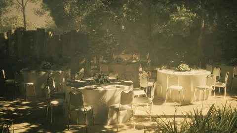 Elegant outdoor dining setup with soft light in a serene garden setting Stock Footage 340666329