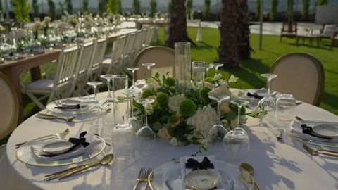 Elegant Outdoor Wedding Reception Table With White Flowers And Gold Cutlery Stock Footage 340595621