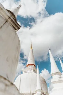 Elegant pagodas of  Wat Phra Mahathat Woramahawihan. Stock Photos