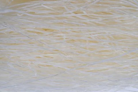 Elegant pattern of stacked clear rice noodles with studio lighting. Macro detail 스톡 사진