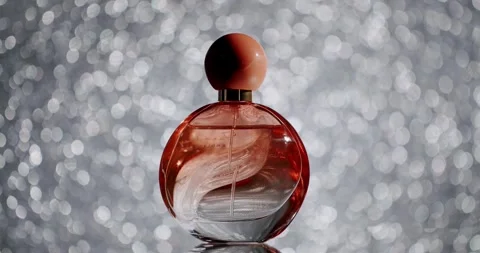 Elegant Perfume Bottle with Sparkling Background for Luxury and Beauty Concepts Vidéo 342805950