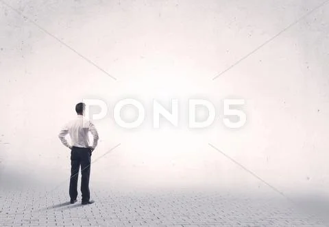 Elegant person standing with his back Stock Photos