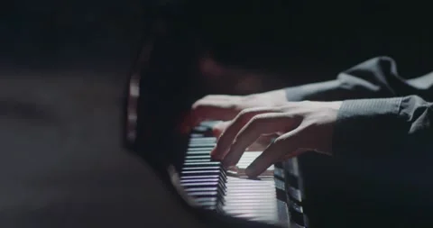 The Elegant Pianists Hands Skillfully Dancing on the Keys, Captured in Fluid Stock Footage 285647425