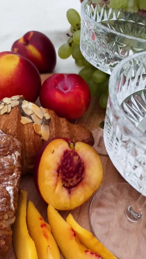 Elegant Picnic Setup with Fresh Fruit and Pastries Stock Footage 289144535