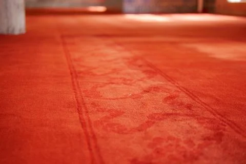 An Elegant Red Carpet Featuring Subtle Patterns Set in a Modern Interior Design Stock Photos