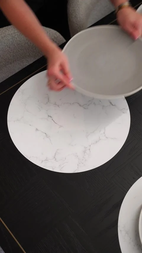 Elegant Restaurant Dining Table Setup with Plates on Designer Placemats Stock Footage 322890454