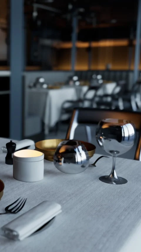 Elegant restaurant table set for dining with soft light in the evening Stock Footage 335356615