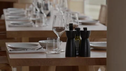 An Elegant Restaurant Table Setting that Includes Various Condiments and Stock Footage 307173527