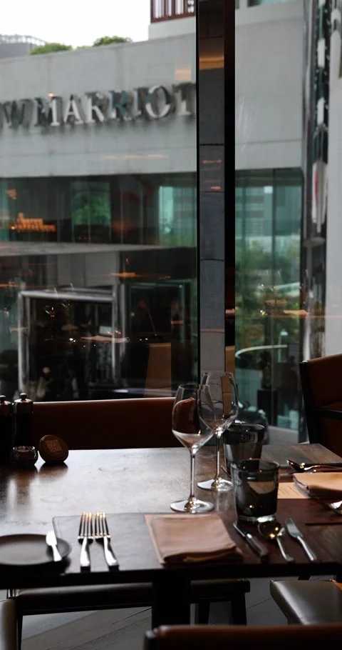 Elegant restaurant table setting in a luxury hotel dining room with ci Stock Footage 327735562