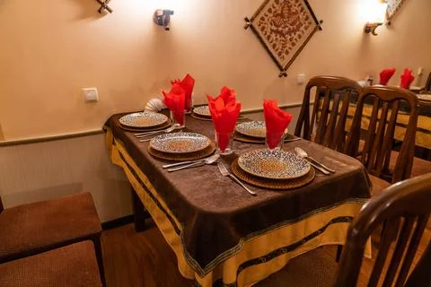 Elegant Restaurant Table Setting with Patterned Plates Stock Photos