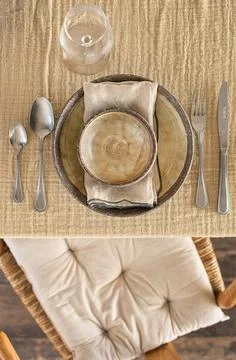 Elegant Rustic Table Setting with Ceramic Plates and Wine Glasses Stock Photos