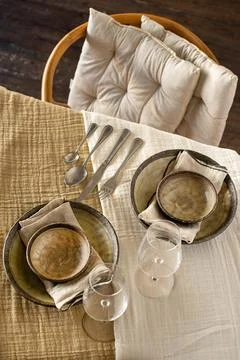 Elegant Rustic Table Setting with Ceramic Plates and Wine Glasses Stock Photos