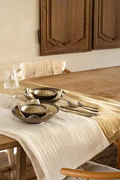 Elegant Rustic Table Setting with Ceramic Plates and Wine Glasses Stock Photos